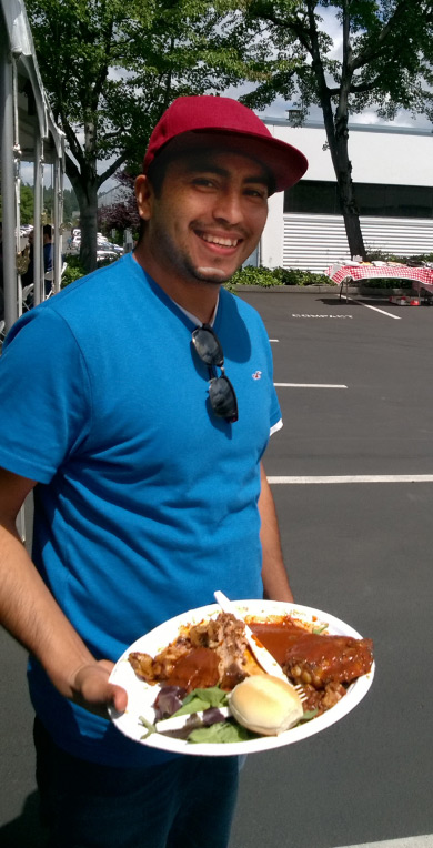 Employee with food at bbq